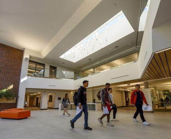 Students walking in the library